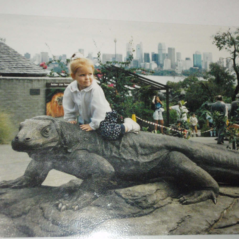 Natureworks Australia Komodo Dragon sculpture - front view- 080121 - shown with lttle girl sitting on top - at Taronga Zoo
