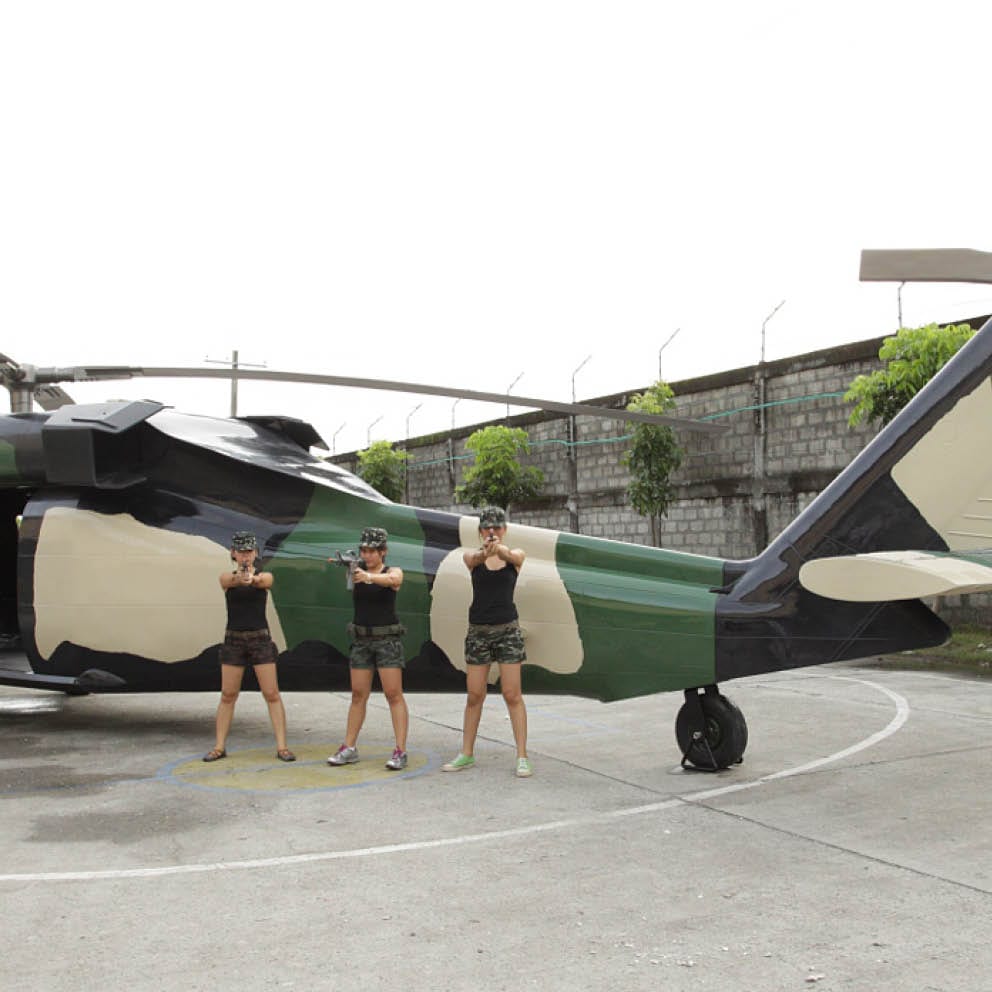 Natureworks Australia Blackhawk helicopter with girls and guns Rear angle view