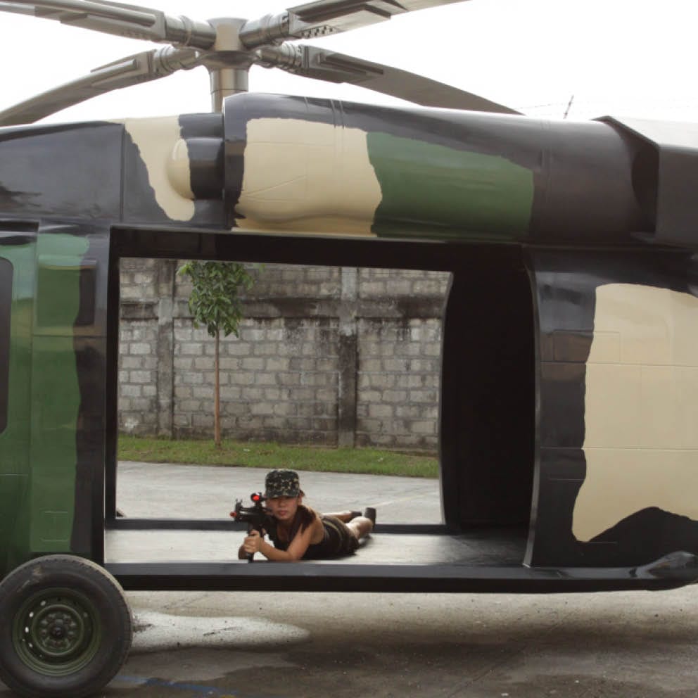 Natureworks Australia Blackhawk helicopter with girls laying down inside
