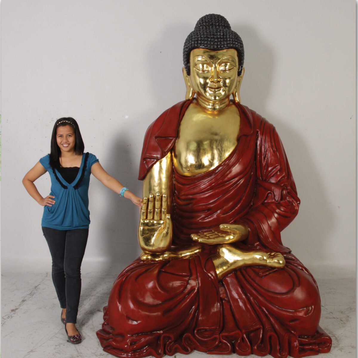 Natureworks Australia Buddha - Giant red with gold leaf finish statue - in sitting pose - SKU 120042 - Rear view- shown with lady