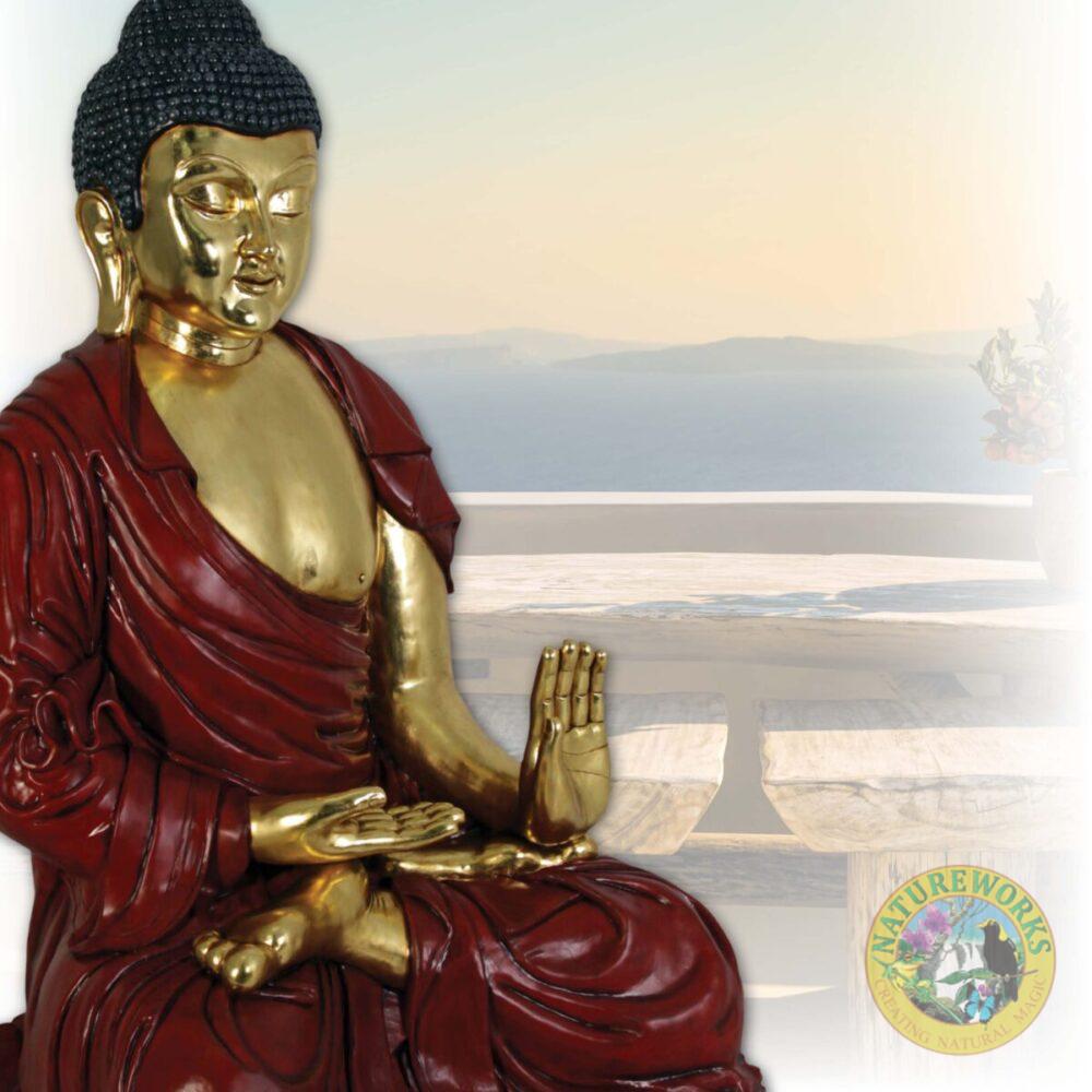 Buddha - Giant red with gold leaf finish statue - in sitting pose - SKU 120042 - angle view with lake in background