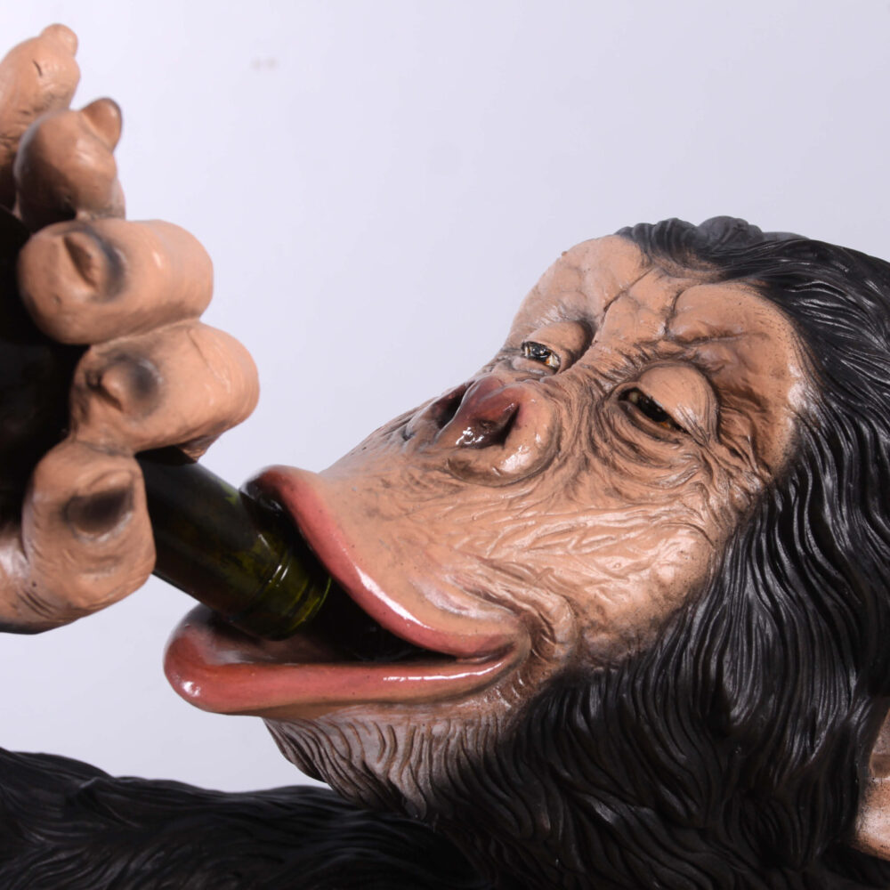 Chimpanzee sitting - statue-bozzy bottle holder - 140099 - close up of bottle in mouth