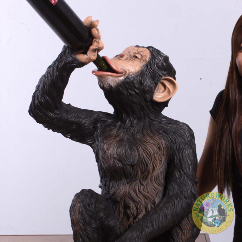 Natureworks Australia Chimpanzee sitting - statue-bozzy bottle holder - 140099 - angle view with bottle