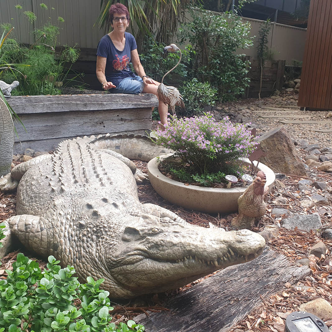 Natureworks Australia 12 ft saltwater crocodile sculpture in garden- 080123- front view