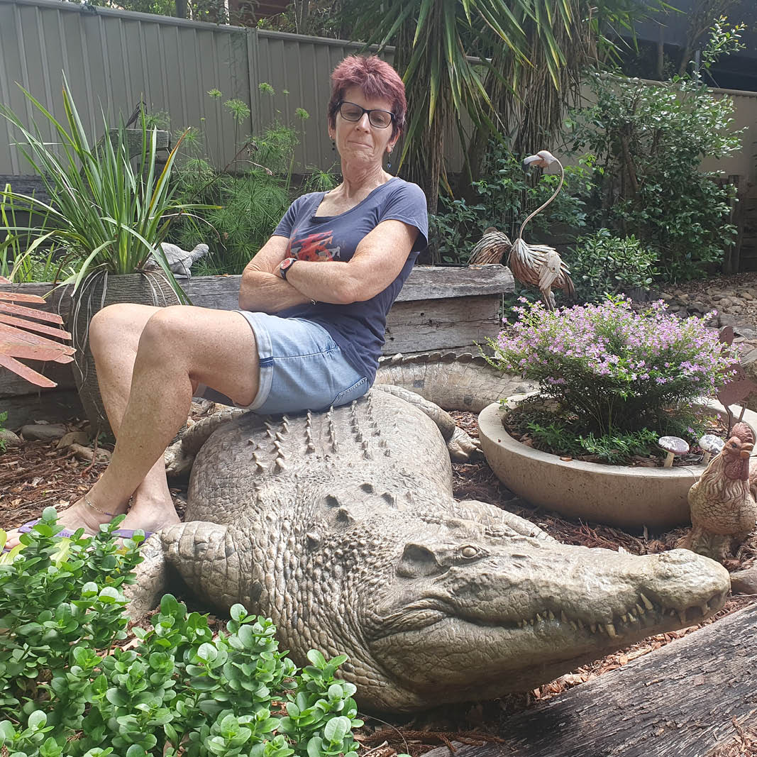 Natureworks Australia Crocodile 12ft - Saltwater - mouth closed - 080123- shown with lady sitting on top- V17
