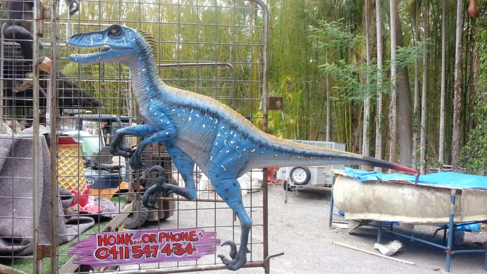 Natureworks Australia Deinonychus Dinosaur Wall Decor - Blue -3D with flat back - ideal as a bedhead, wall decor or themed exhibit - SKU 140029- shown on gate