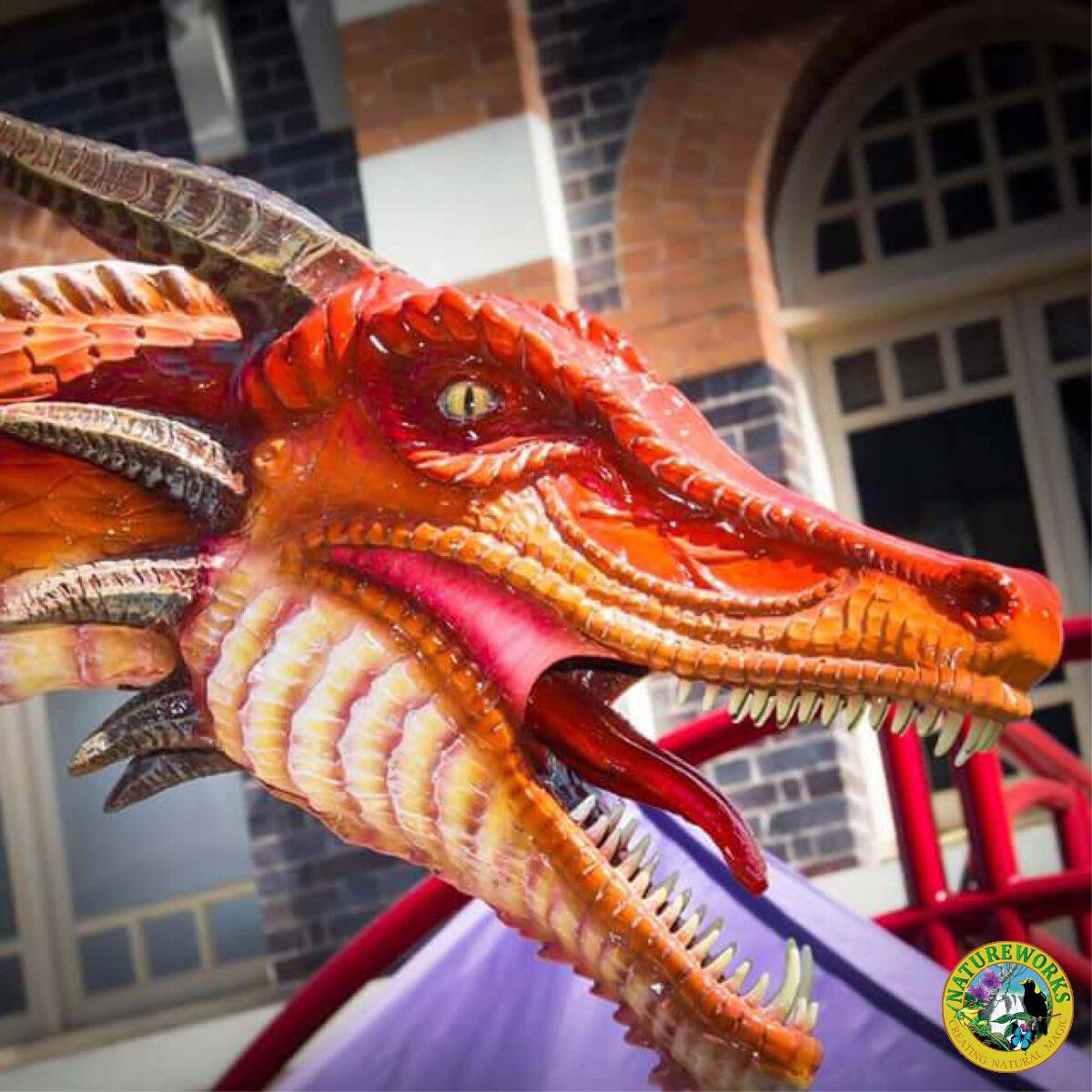 Natureworks Australia Dragon STanding - 7ft Red - 100043- shown on float at medieval festival - close up of head