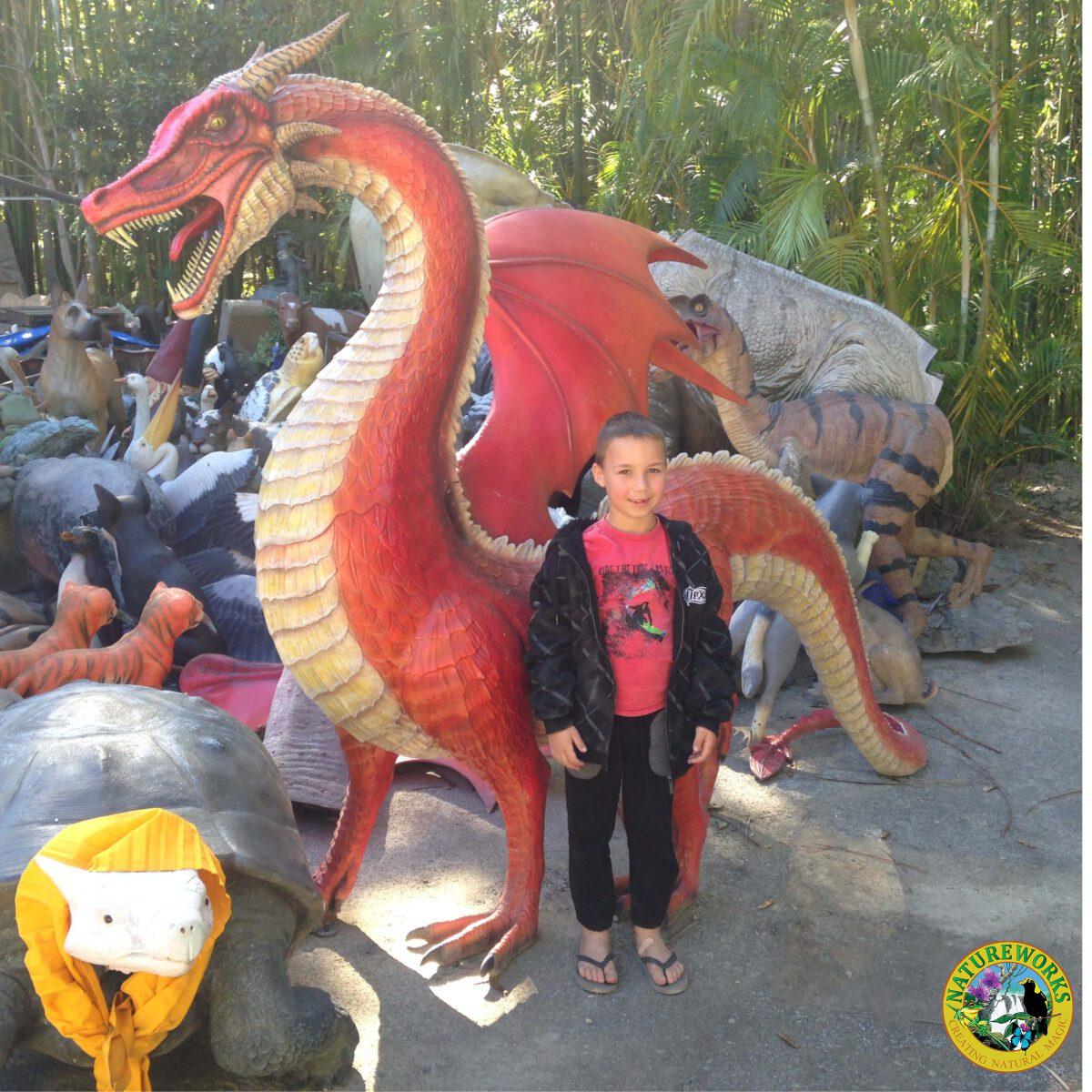Natureworks Australia Dragon STanding - 7ft Red - 100043- shown on float at medieval festival - shown with little boy