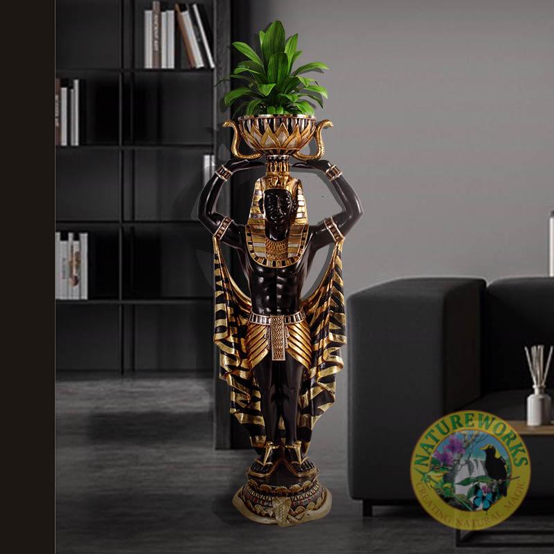 Natureworks Australia Egyptian_Planter_Holder_Male_4ft_PLEM4- shown in decor setting. Gold leaf and black