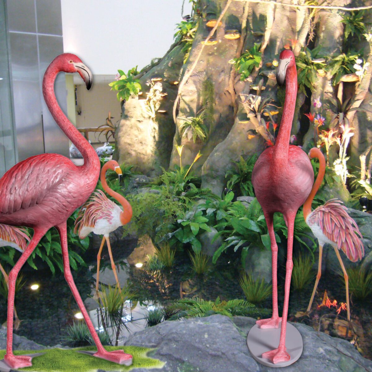 Natureworks Australia Flamingo Pink - Bird - 110038P - standing pose on oval base plate - long skinny legs and elegant necks- perfect for tropical themed events - shown at the base of tree of life front and side view