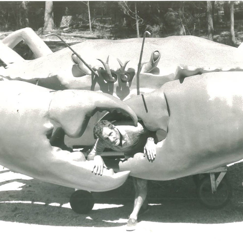 Natureworks Australia Giant Crab On Post Cardwell Black and White photo with young guy before installation