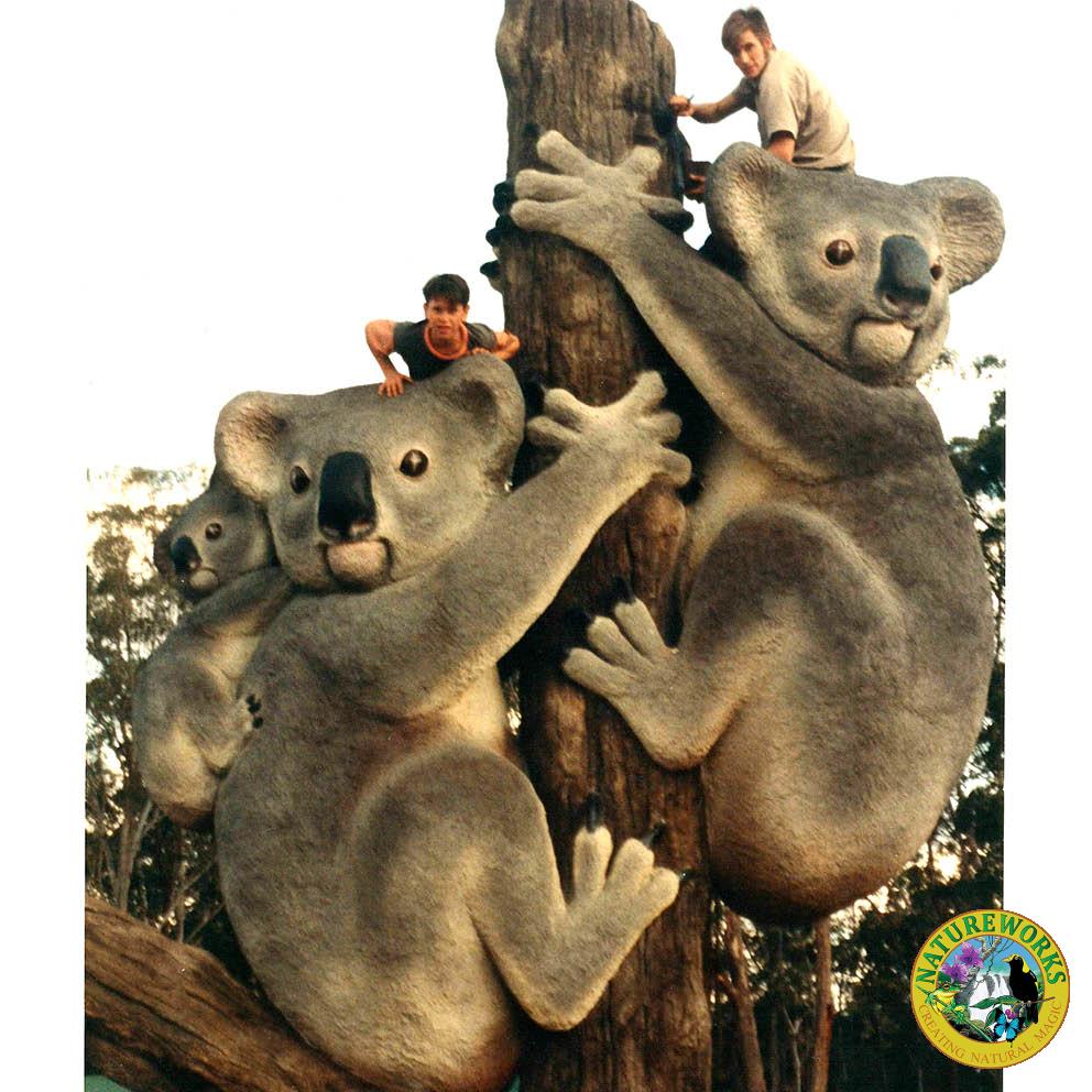 Giant Koalas on Tree Stump with boys