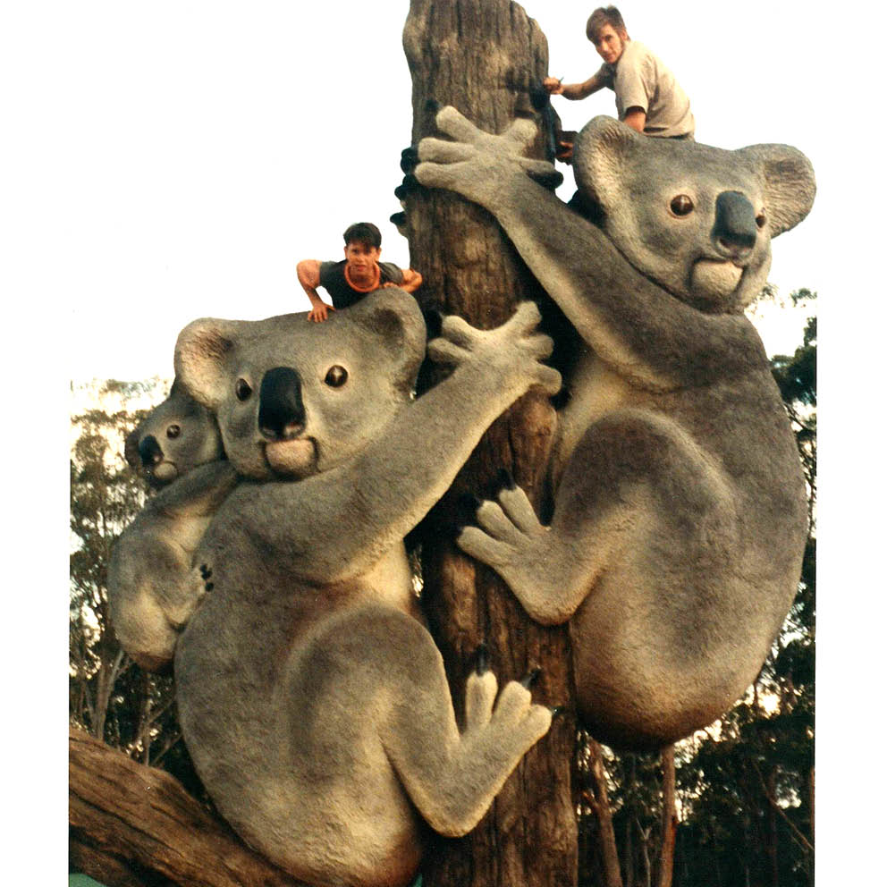 Giant Koalas on Tree Stump with boys