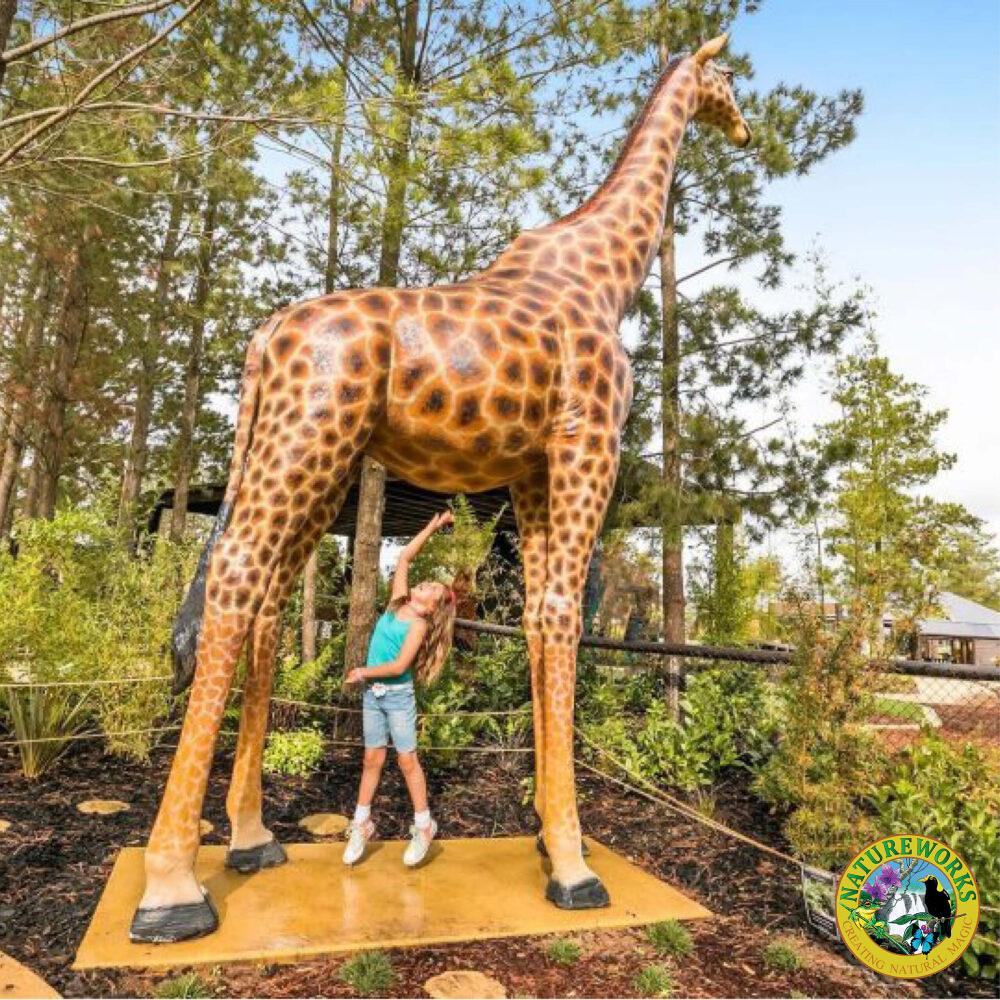 Giraffe-18ft-side view-shown displayed in playground with child underneath-140039