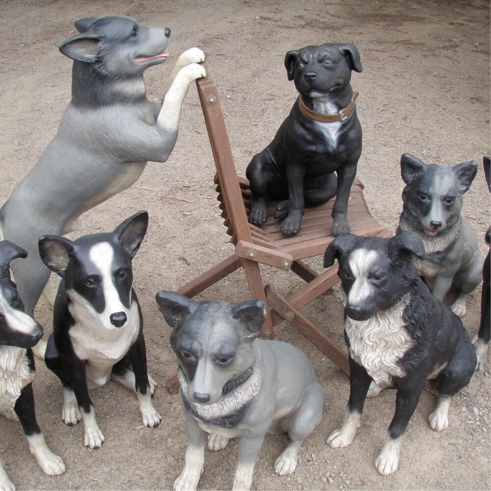 Border Collie dog statue- 080070-shown in a group of other dogs waiting for treats.