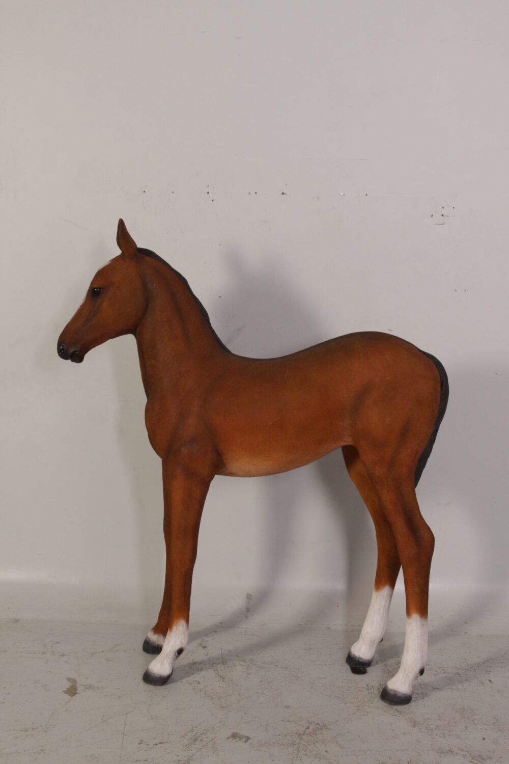 Horse Foal standing - 120043 Brown - shown with life-size horse standing - side view looking left