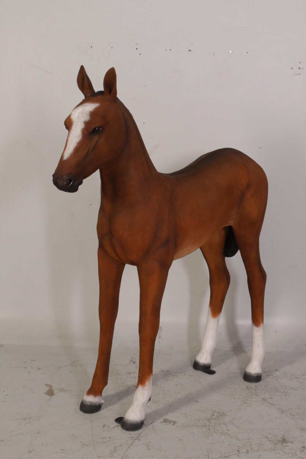 Horse Foal standing - 120043 Brown - shown with life-size horse standing - front angle view