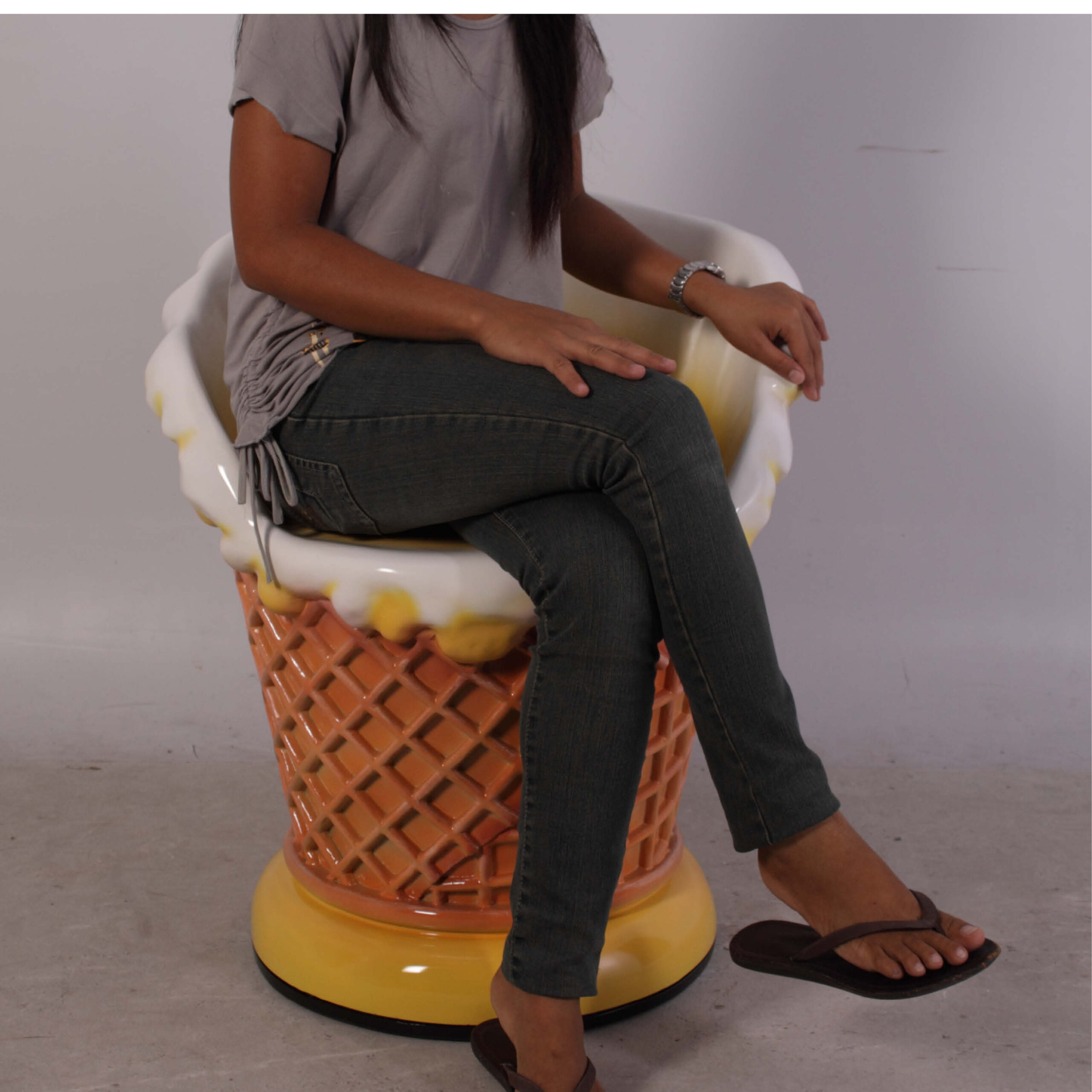 Natureworks Australia Ice Cream chair - langka 130020Langka- yellow colour chair / seta for ice cream parlours and shop fronts- shown with girl sitting in seat-
