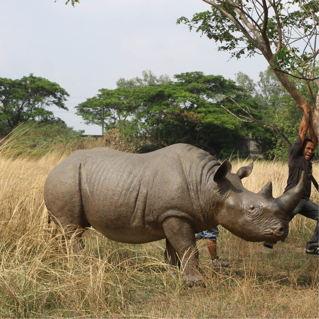 Natureworks Australia Natureworks Rhino statue - side view - shown outside140042