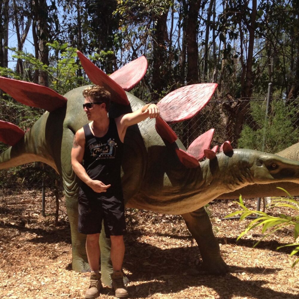 Stegosaurus Dinosaur with male model - 100045- outside view