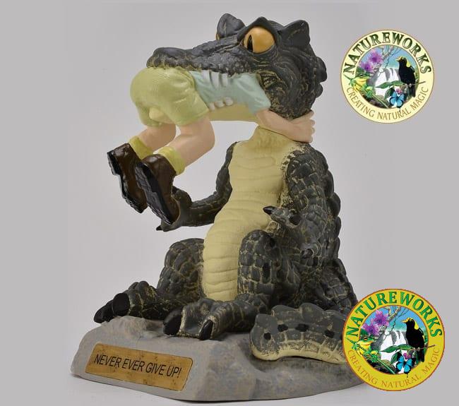Never Ever Give Up Figurine With Crocodile eating someone
