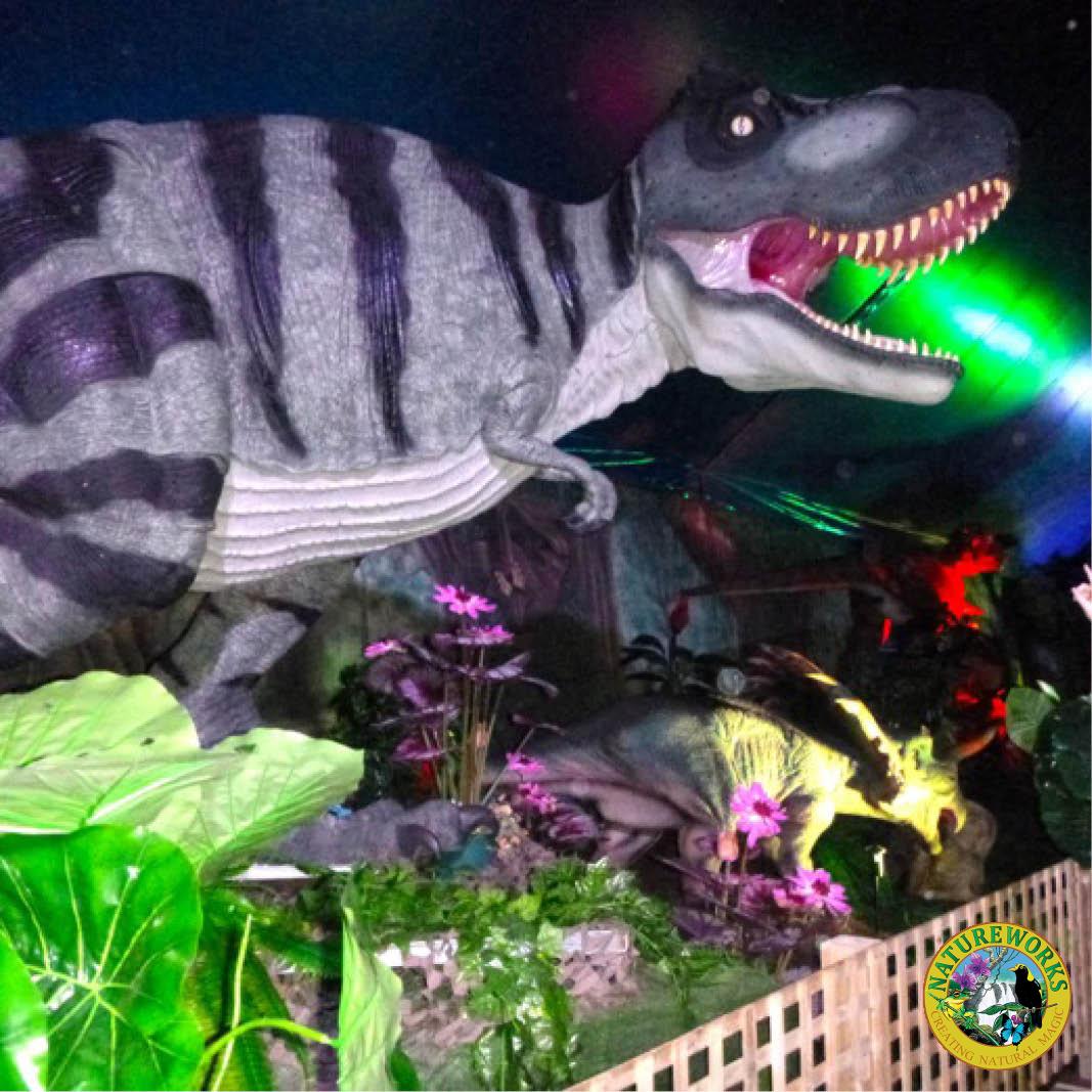 Natureworks Australia Tyrannosaurus Rex - natural painted finish - walking pose- shown in exhibit with lighting and decor- 110073