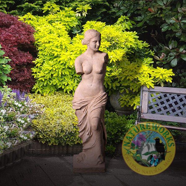 Natureworks Australia Venus De Milo Statue - Roman Stone 150275RS- Shown outside in garden