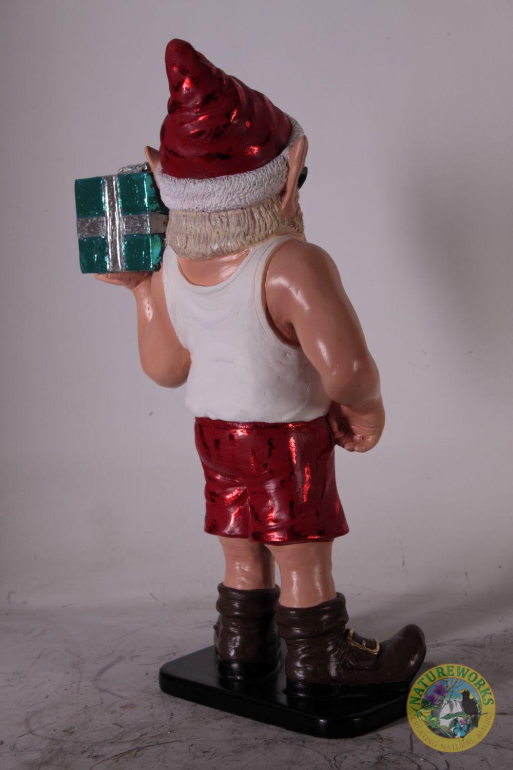 Natureworks Australia Rear view of Christmas elf statue showing Santa hat, tank top, and red shorts.