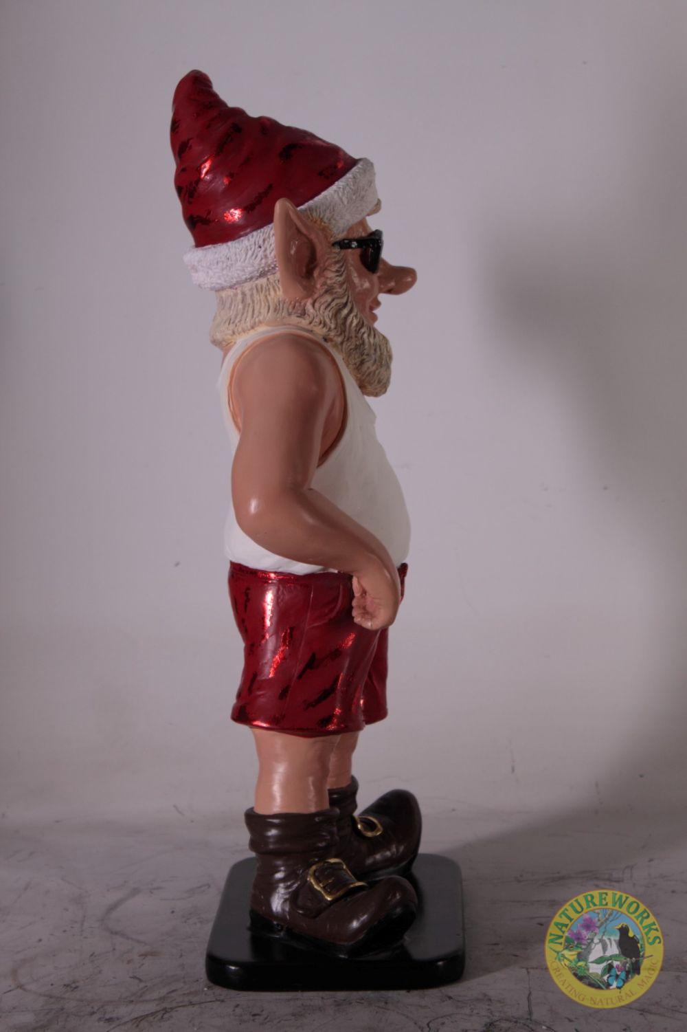 Natureworks Australia Left side profile of Christmas elf statue with Santa hat and red metallic shorts.