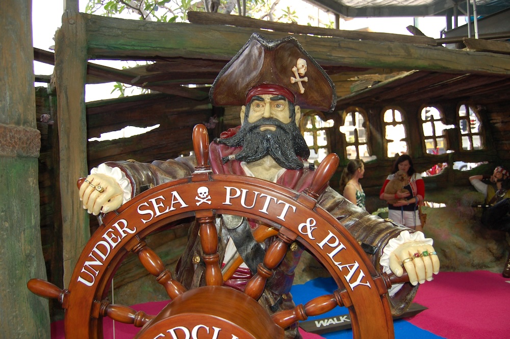 Natureworks Australia sculpture of Pirate at ships wheel in Undersea Putt n Play pirate mini golf