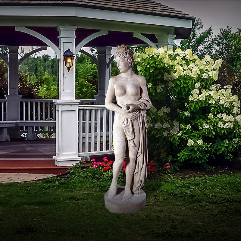 Natureworks Australia Venus holding apple - statue - 090041Rs - Roman stone - shown in garden setting