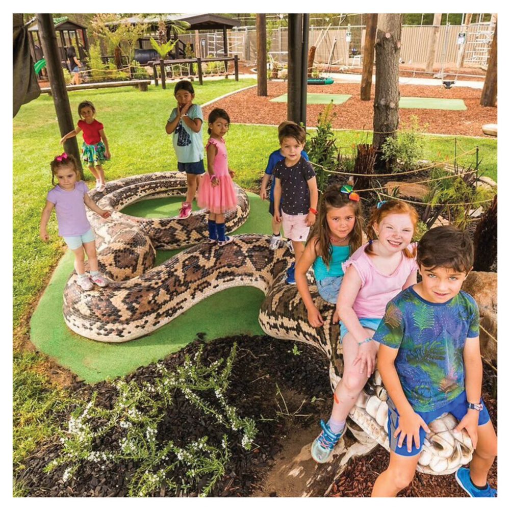 Giant snake in playground with children