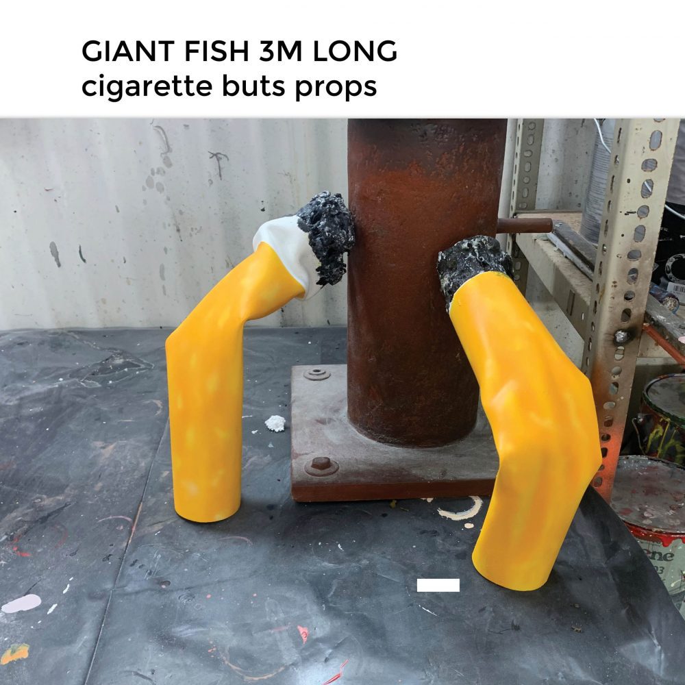 Fish 3m long with pollution debris- showing larger than life-cigarette buts debris