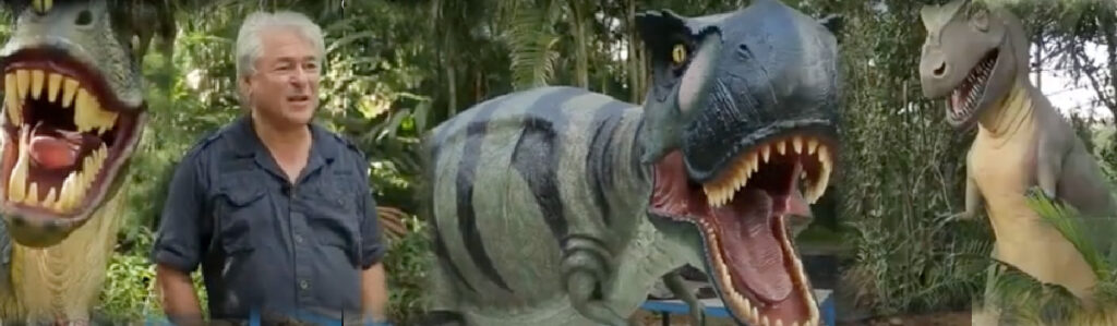 David Joffe from Natureworks, shown with sculptures of dinosaurs and prehistoric animals