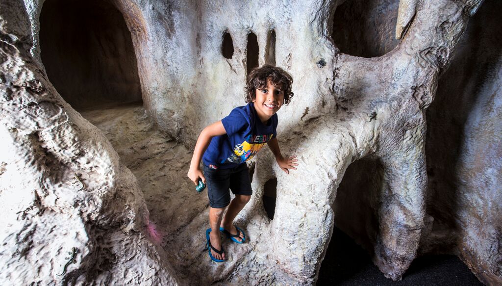Child exploring the cave