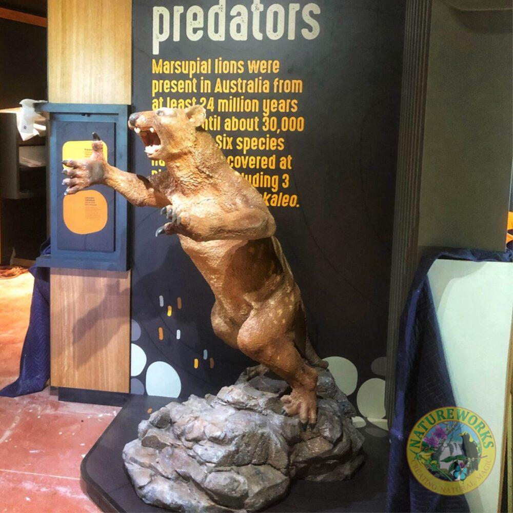 Thylacoleo leaping on rock base- sculpture