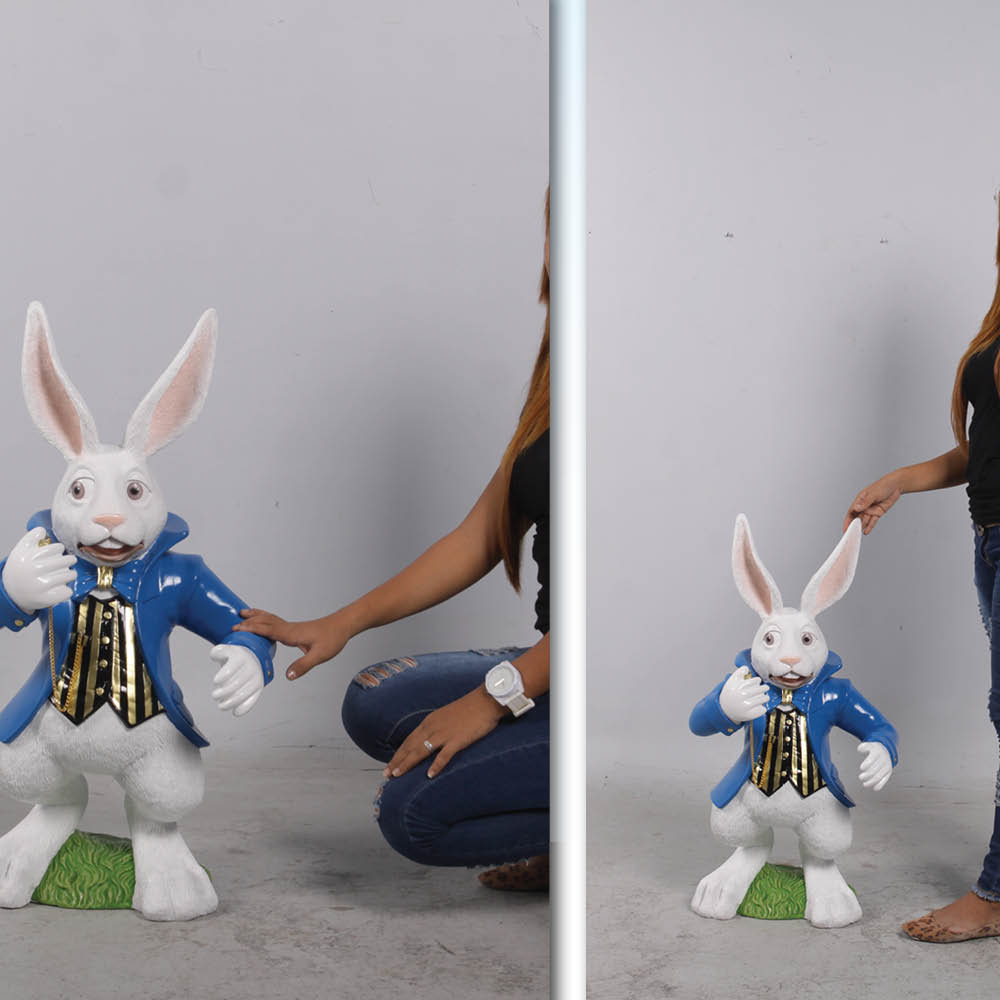 Natureworks Australia Alice in Wonderland White Rabbit Statue with blue jacket and pocket watch. shown front view with Lady