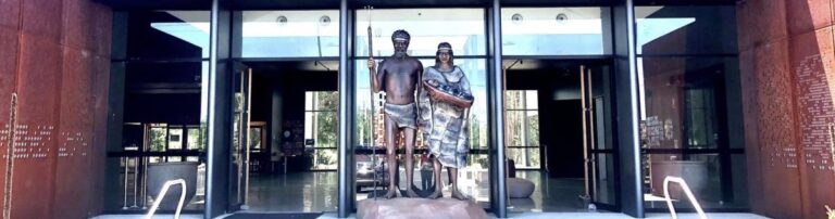 Murrook Culture Centre entrance with aboriginal warrior statues