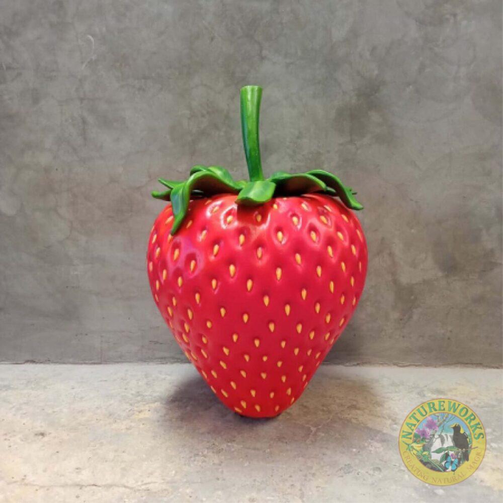 Straweberry larger than life-size prop - our larger-than-life-size strawberry prop - a vibrant and delectable addition that's perfect for a variety of applications. This realistic strawberry replica is designed with attention to detail, measuring a substantial Length of 71cm, Width of 70cm, and Height of 105cm