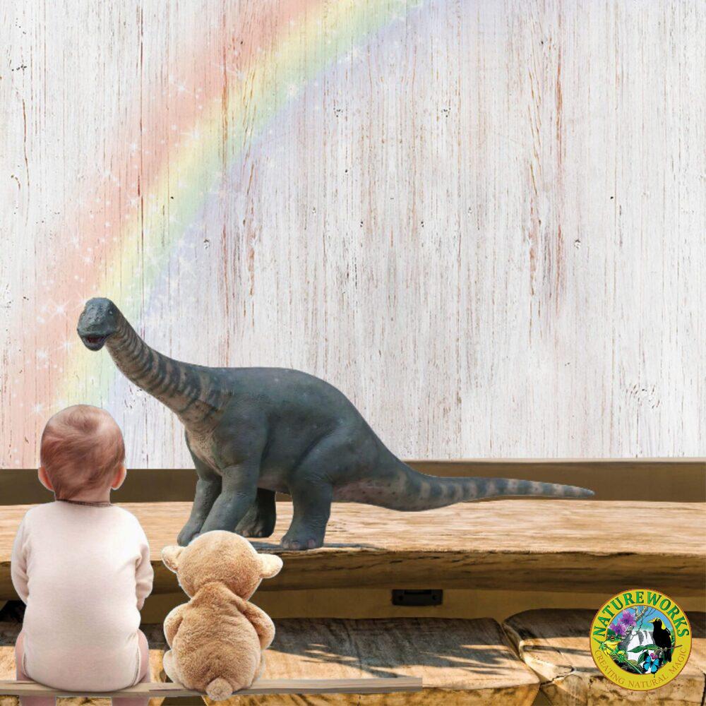 Rhoetosaurus browni mini dinosaur statue - 230127- shown iwht little child