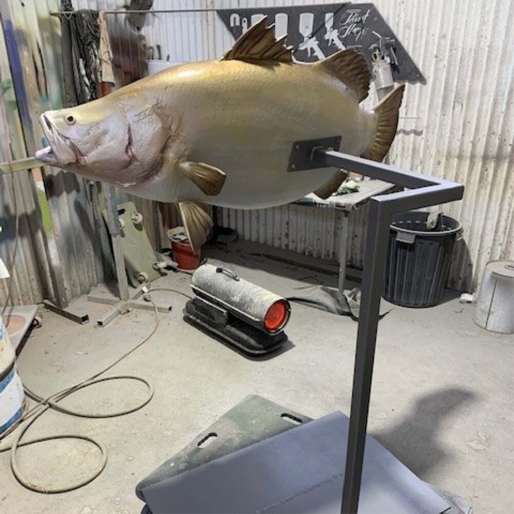 Barramundi fish - 1.3m long sculpture - in production at Natureworks Studio showing stand and angle view