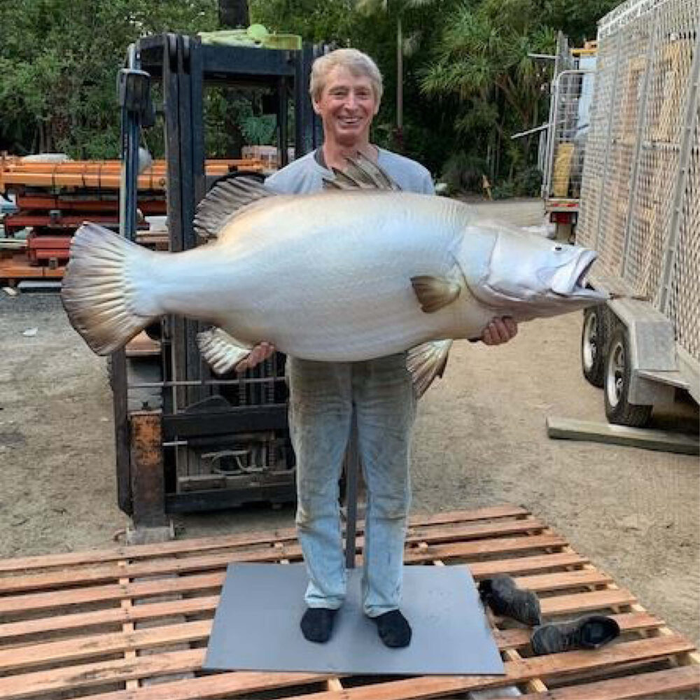 Barramundi fish - 1.3m long sculpture - shown with man holding barramundi finished ready for delivery