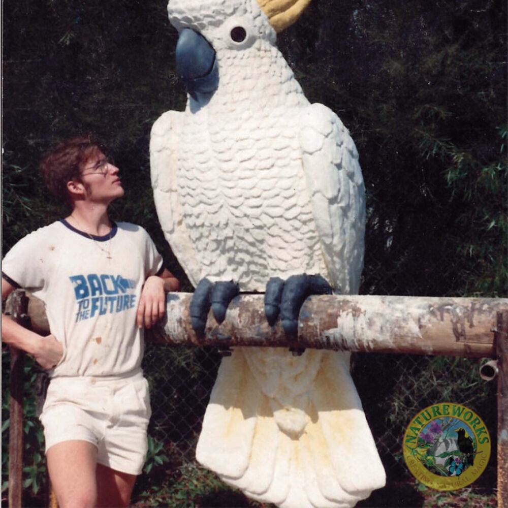 Cockatoo-Sulphur Crested 2m High Sculpture - size in comparison with a man standing next to scullpture- Front angle view-in situ at Mosman Hotel