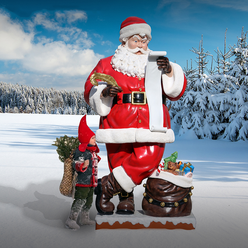 Natureworks Australia Giant 9ft Santa Statue Standing holding wish list and feathers gold quill. with a sack of toys at the base