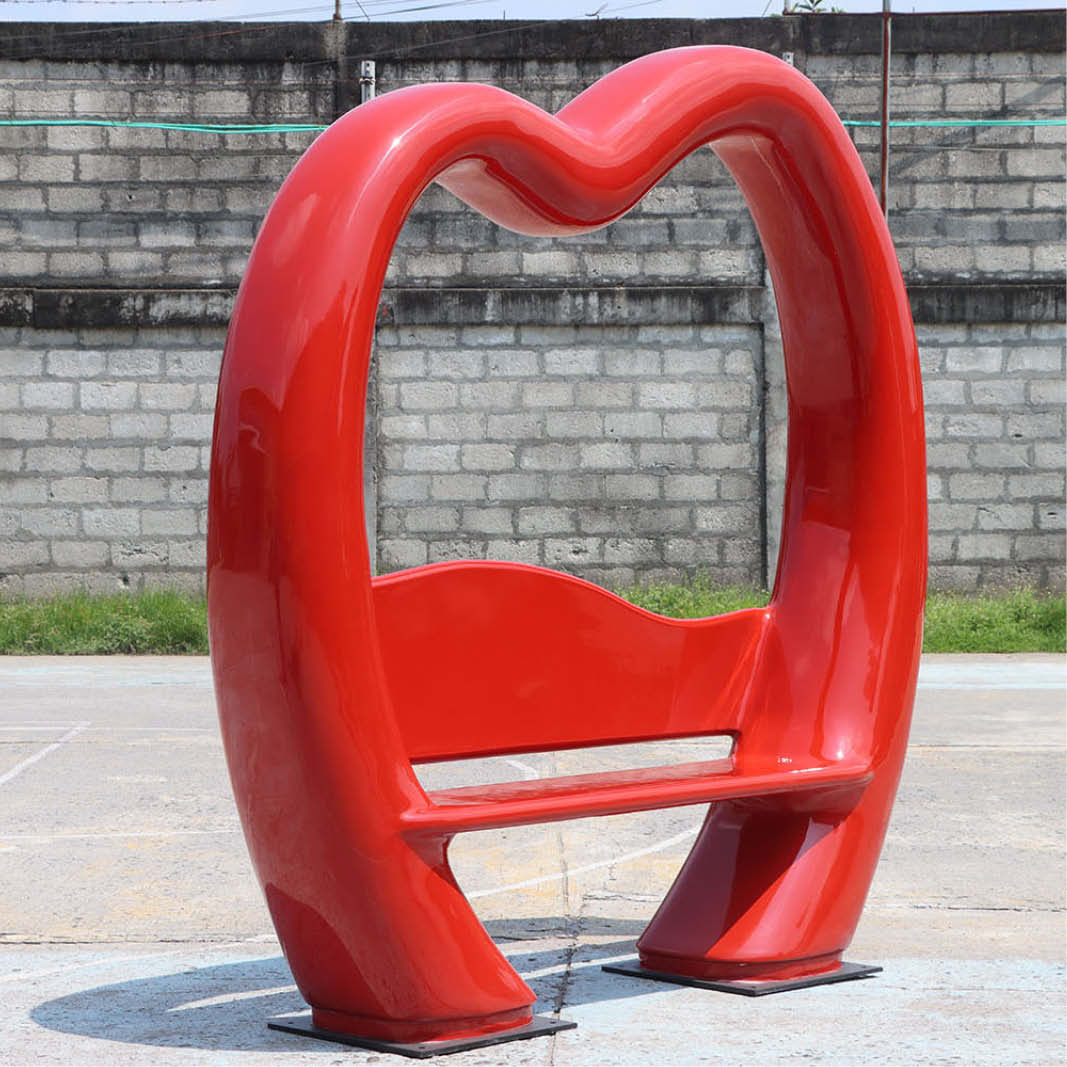 Natureworks Australia Lovers Lounge 240087 - love bench - sturdy construction - bright red colour for weddings and valentines displays- playgrounds, and public parks- shown on angle