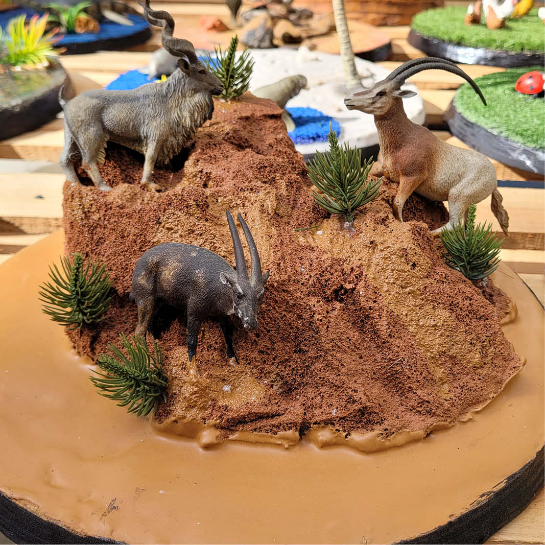 Natureworks Australia Play and discovery cloches with internal miniature dioramas- goats