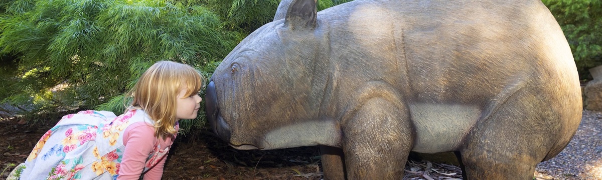 Natureworks Australia Girl with Phoscolonus giant wombat sculpture at Australian National Botanic Gardens