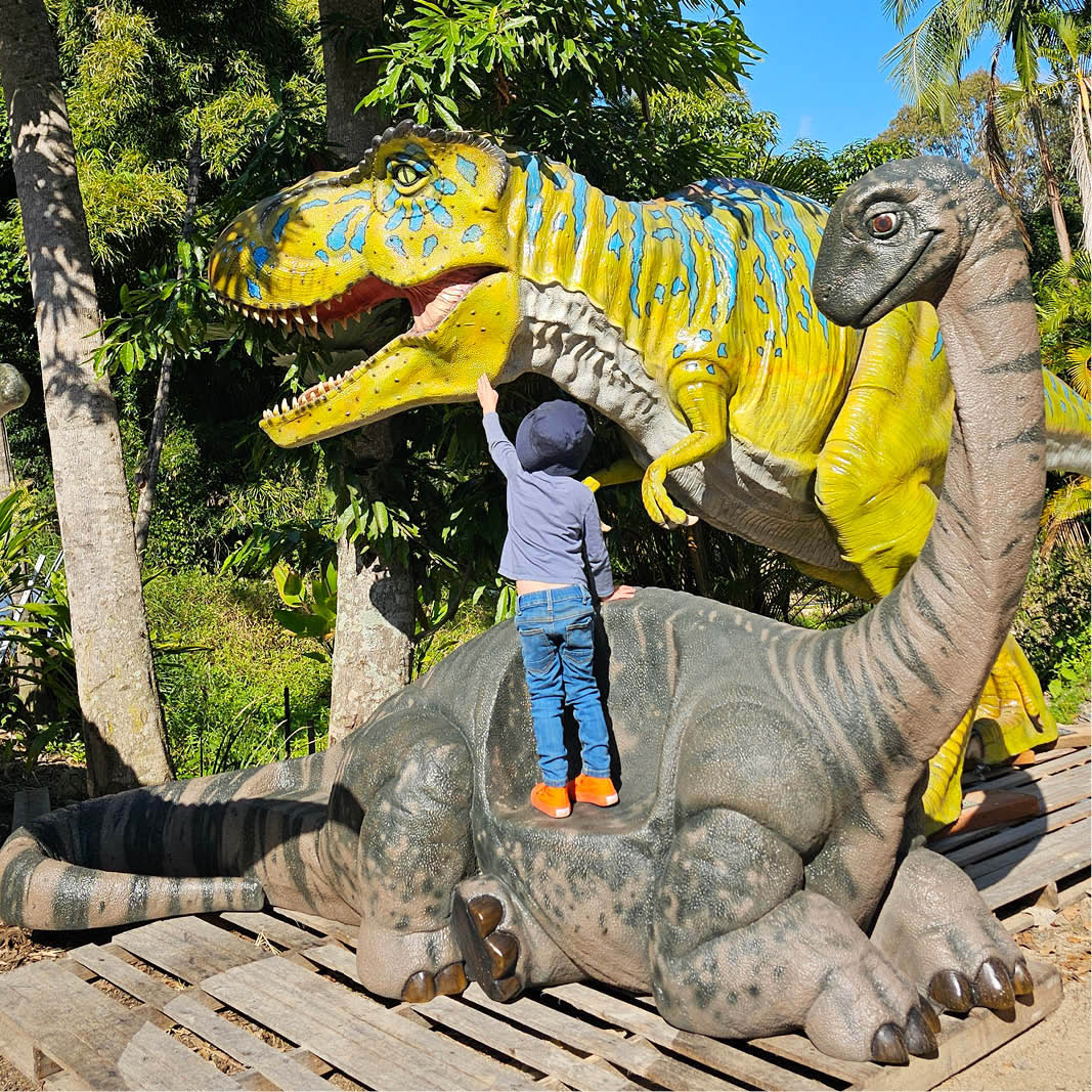 Natureworks Australia T-Rex Dinosaur Walking Large - 110073Green & Blue showing boy reaching the dinosaur