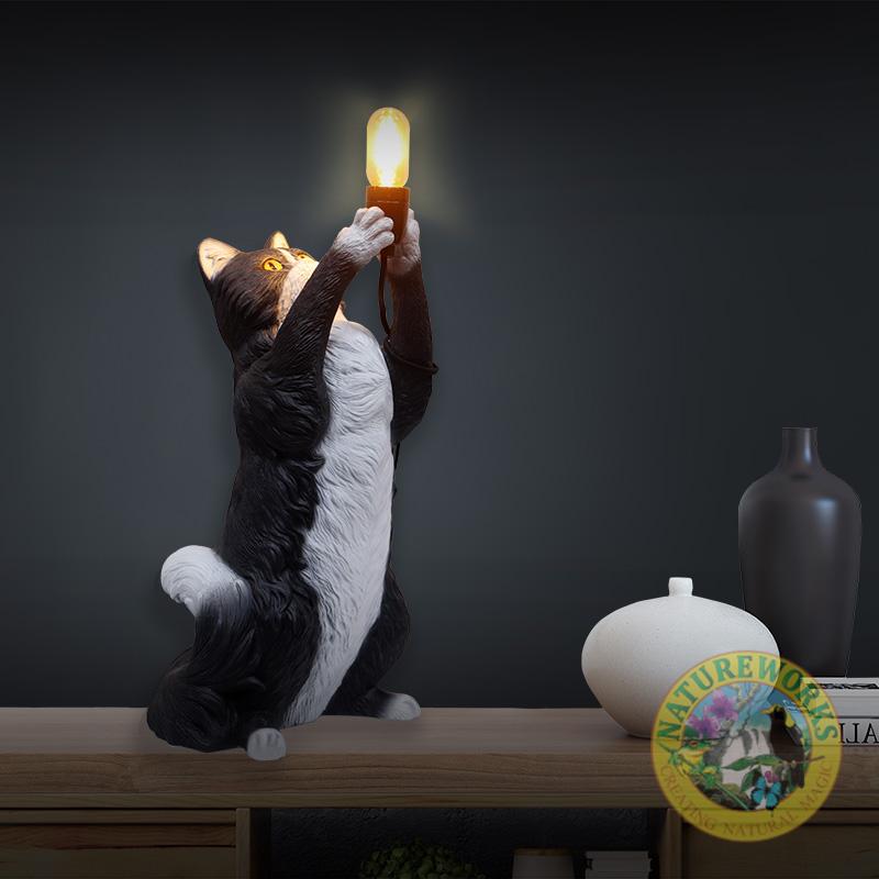 Cat table Lamp - Black & White - lifelike black and white cat inspired by the playful nature and grand size of Maine Coon- L 30 x w 28 x H 66cm - 3kg - SKU 230024