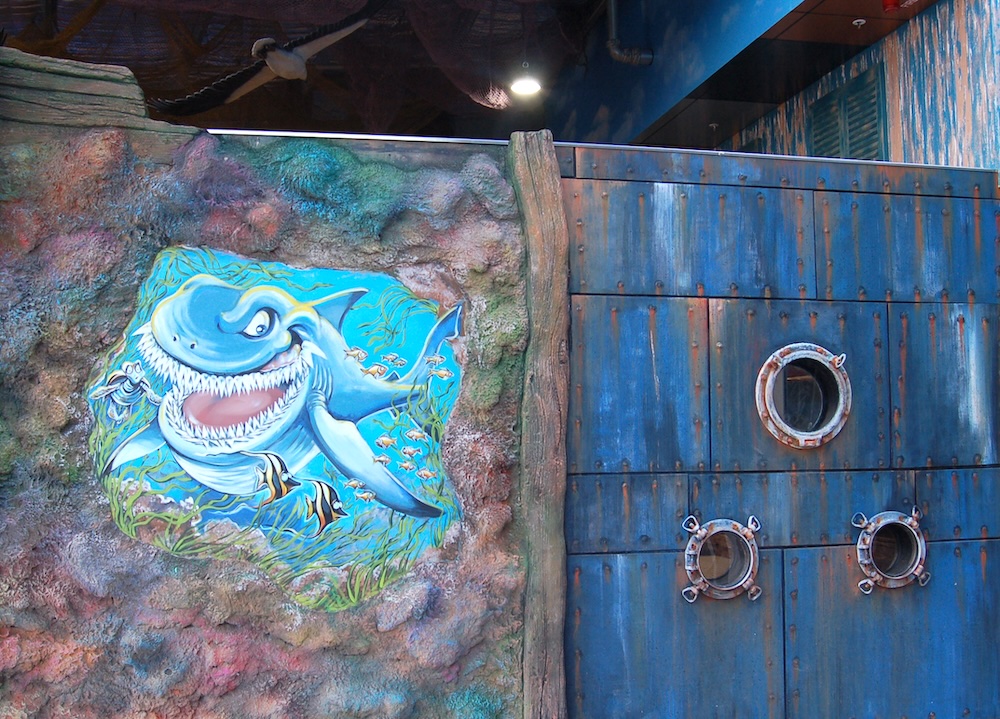 Natureworks Australia Undersea putt & play facade with shark mural and porthole windows